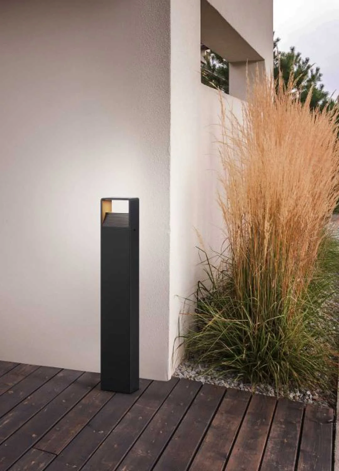 Outdoor lighting placed beside a wall