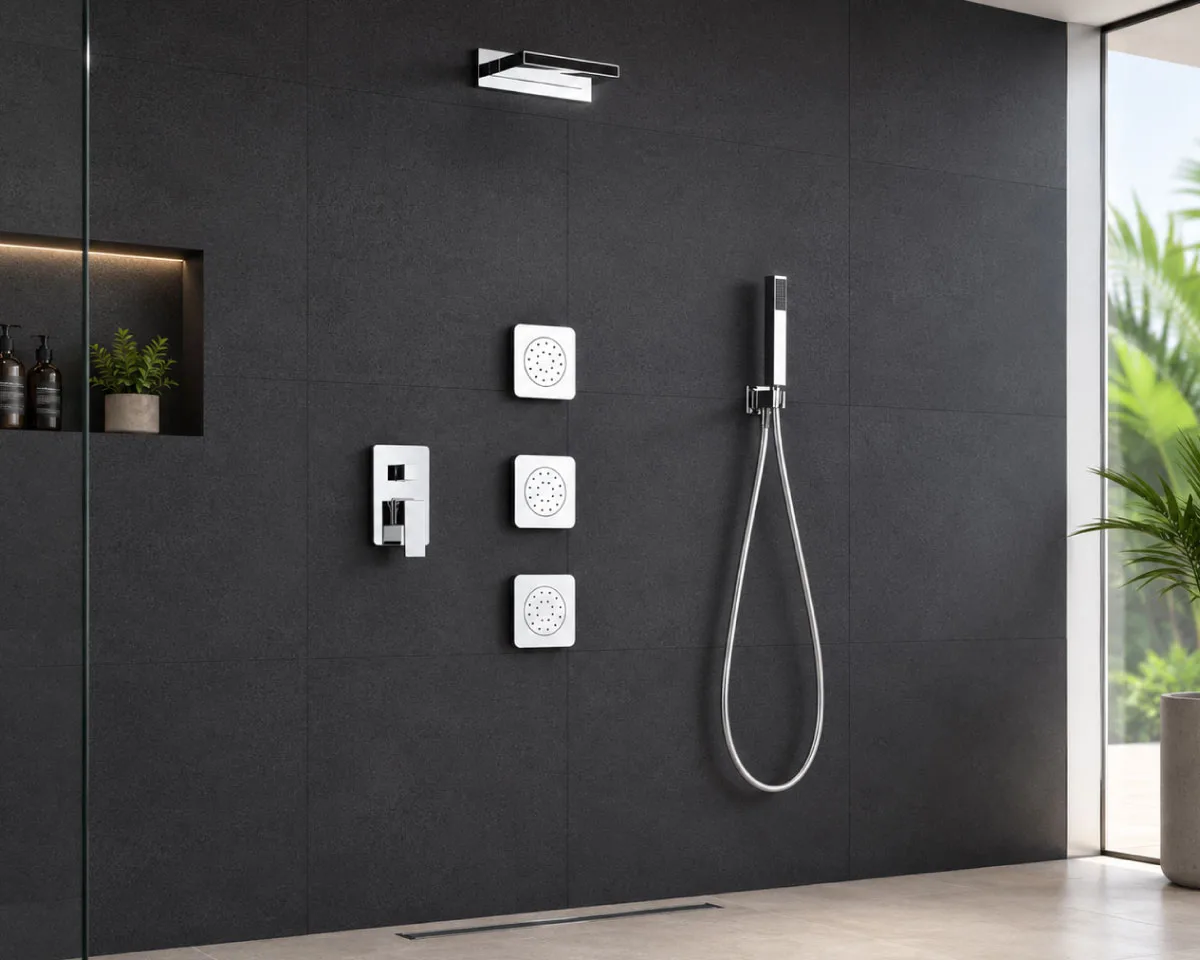 Modern built-in shower system featuring an overhead shower, handheld shower, body jets, and chrome mixer set against elegant dark bathroom wall tiles for a premium spa-inspired design.