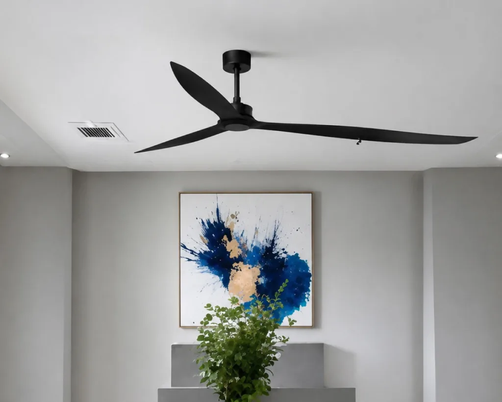 Contemporary living room with a sleek black 3-blade ceiling fan installed on a white ceiling. The modern fan provides efficient air circulation while adding a sophisticated touch to the interior décor.